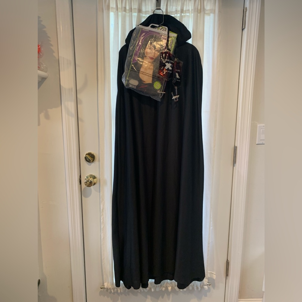 Vampire cape and t-shirt , vampire wig and fake blood bag. Halloween